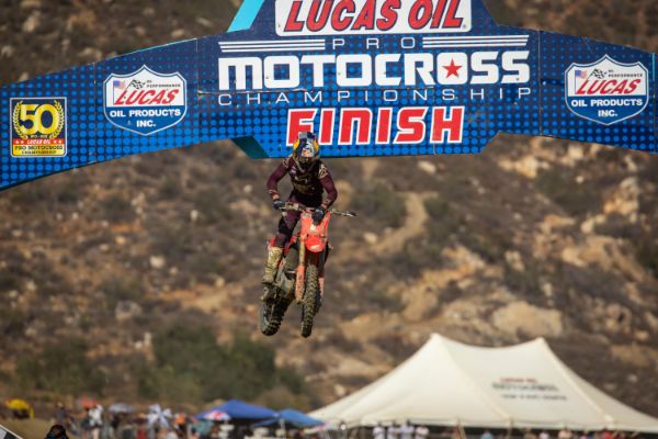 Jett Lawrence does a number plate slap as he claims the 2022 250 Class Pro Motocross title.